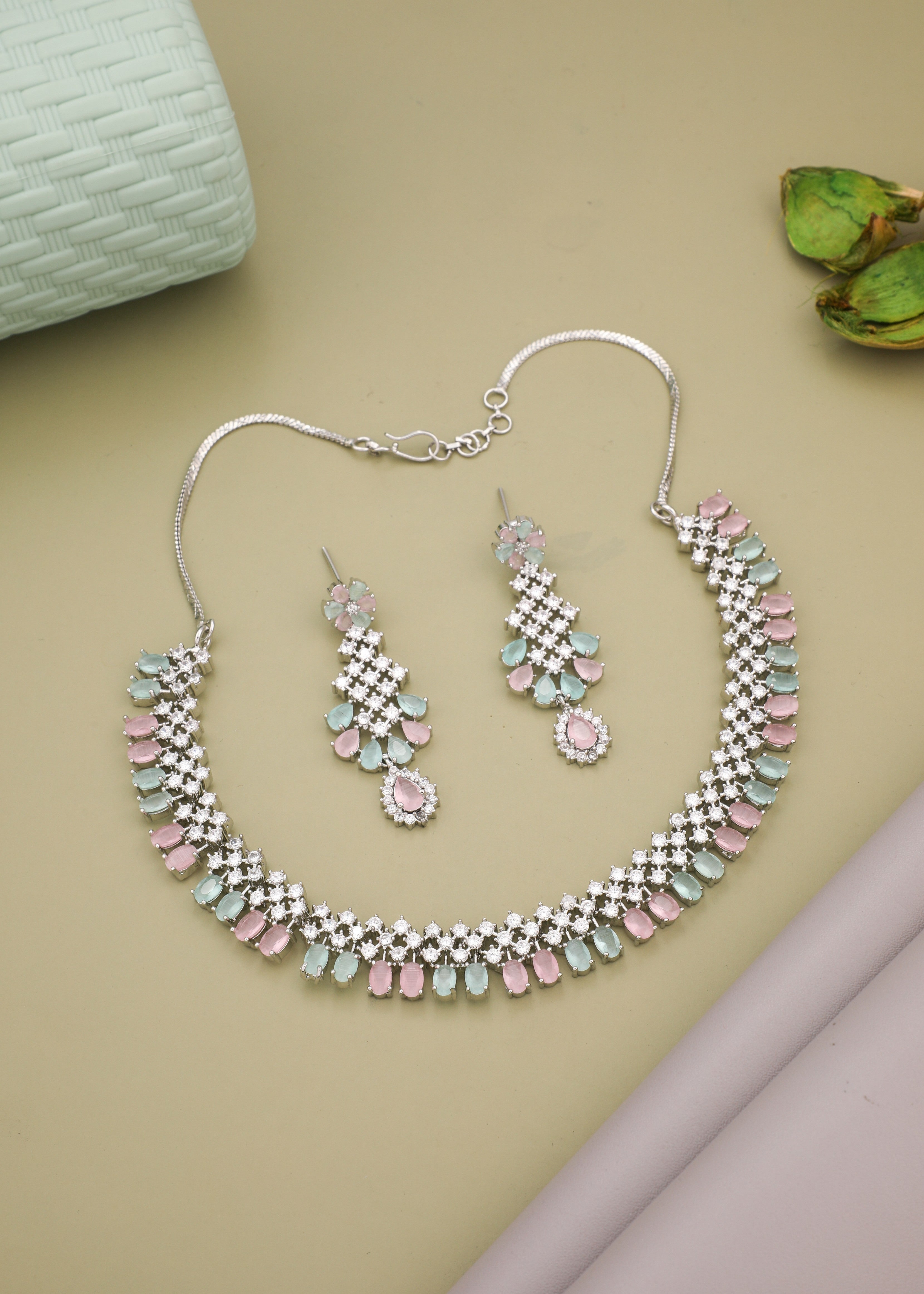 Rhodium Plated Sea Green With Light Pink Sapphire Zircons Studded Necklace Set.